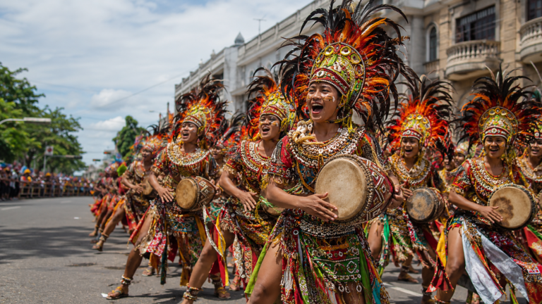 Dinagyang Festival performers with drums during a street performance in Iloilo City