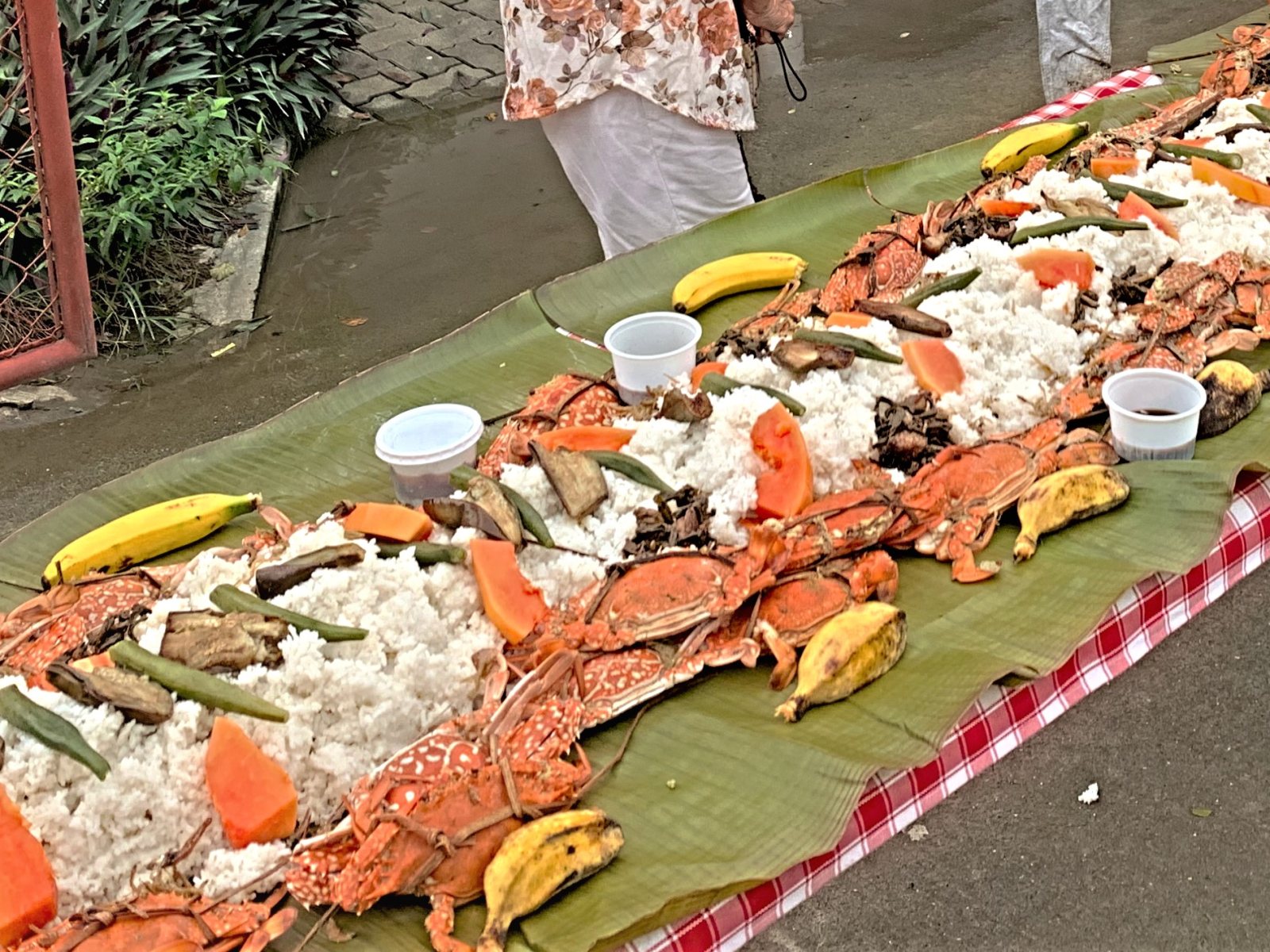 A fiesta table in Banate, Iloilo: rice, crab, and fruit on banana leaves at the Kasag Festival